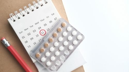 contraceptive pill and a calendar.