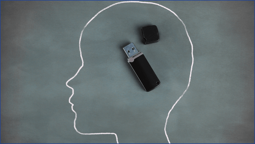 Usb stick in a person's brain signifying memory