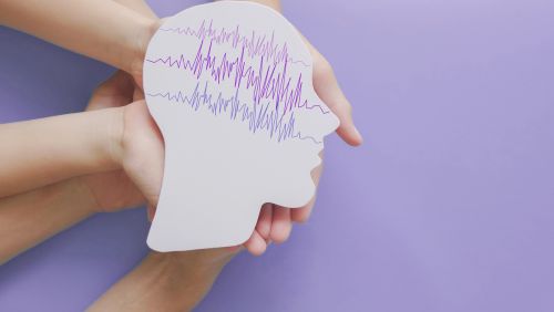 Image of child holding a picture of a brain