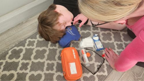 Person adminstering Buccal Midazolam to another person