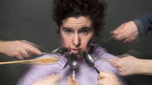 Lorraine Lally surrounded by spoons