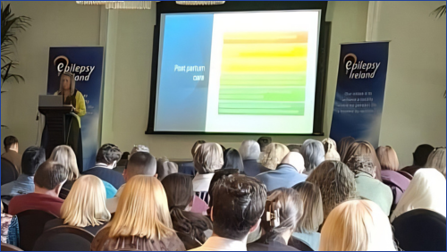 People in a crowd listening to a speaker at the 2026 National Conference