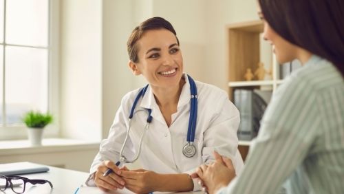 doctor talking to their patient.