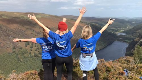 Three people on a mountain in EI Tshirts