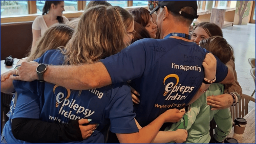 Group hug at Family Fun Day 2025
