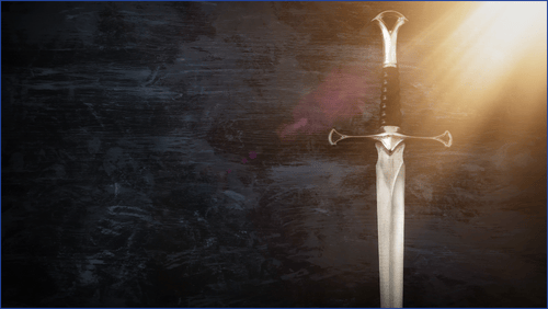 Hilt of a sword on a grey background