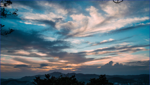 Sky with sunset colours such as blue and pink