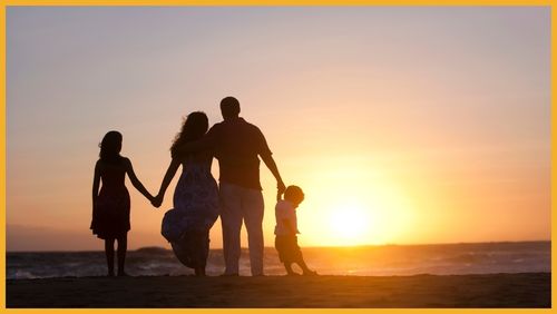 Family looking out at a sunset