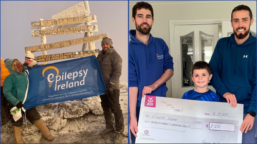 Mark at the top of Kilimanjaro and presenting cheque with Ciarán of funds raised