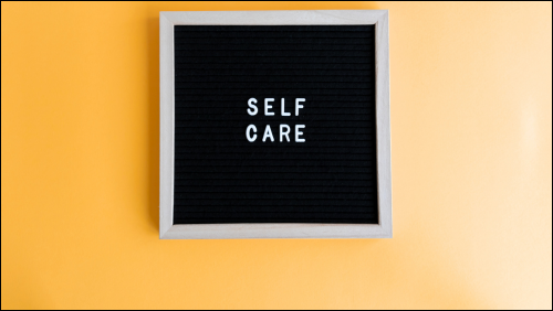 Blackboard with self-care written on it