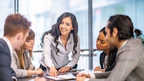 staff in discussion in a team meeting.