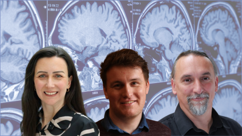 Christina, Gary & Tobias in front of an image of brain scan.