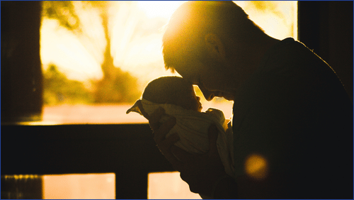 Man holding baby