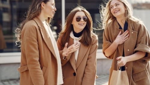 Group of women talking and laughing.