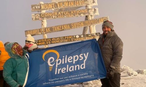 Mark on top of Kiliminjaro with EI flag