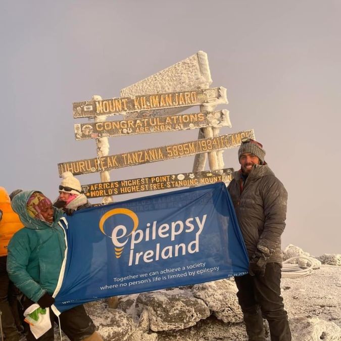 Mark on top of Kiliminjaro with EI flag