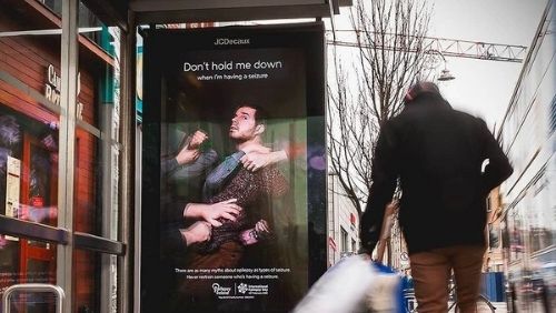 our International Epilepsy Day campaign from 2020 being displayed on a bus stop billboard