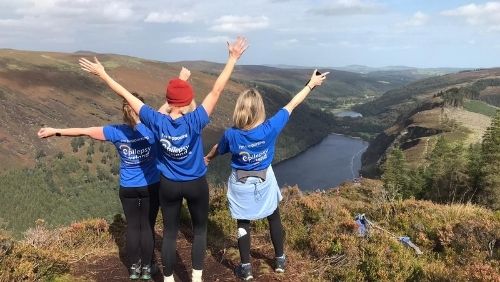 three Epilepsy Ireland volunteer looking over a valley.