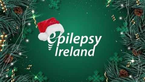 Epilepsy Ireland Logo with Santa hat with Christmas garland background