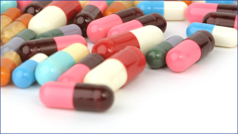 Pink, blue and white medicine tablets
