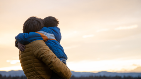 Parent hugging child