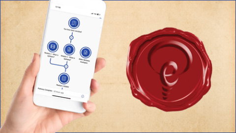 Hand holding iphone with epilean app and seal of a degree on a background of parchment