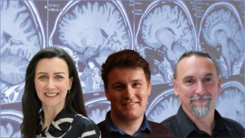 Christina, Gary & Tobias in front of an image of brain scan.