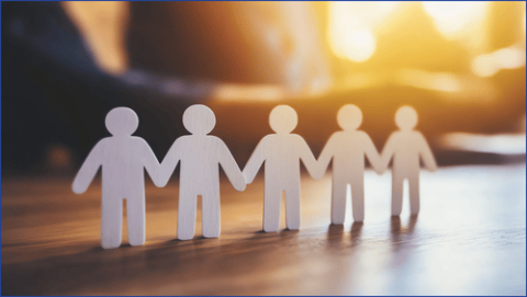 Stick men holding hands with sunset in background