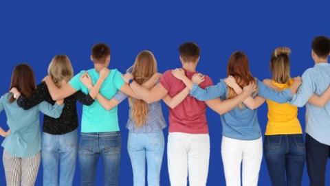Group of people with their arm over eachother