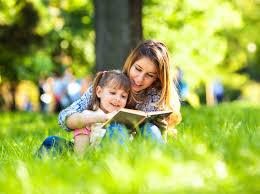 Child reading book with mum